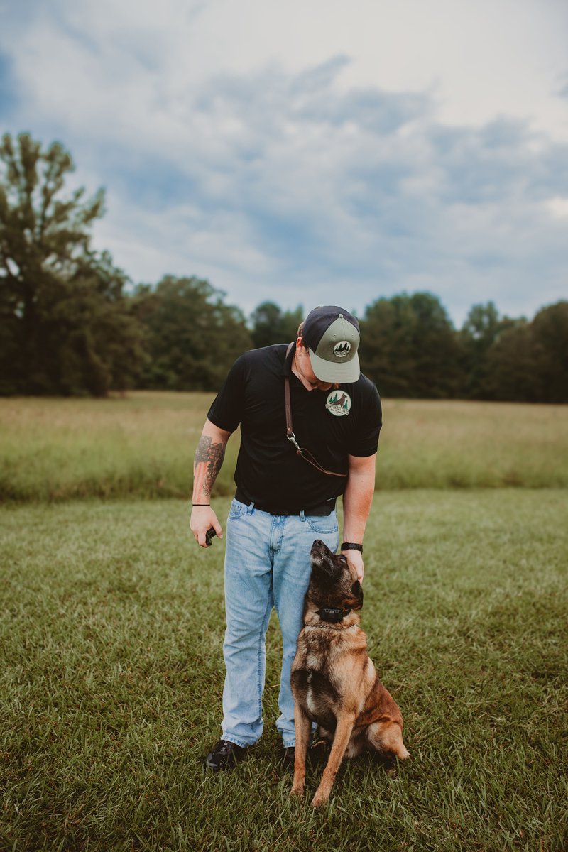 Alexander with a Belgian Malinois